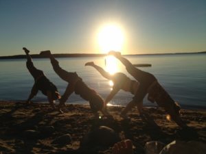 Yoga on the beach at sunrise
